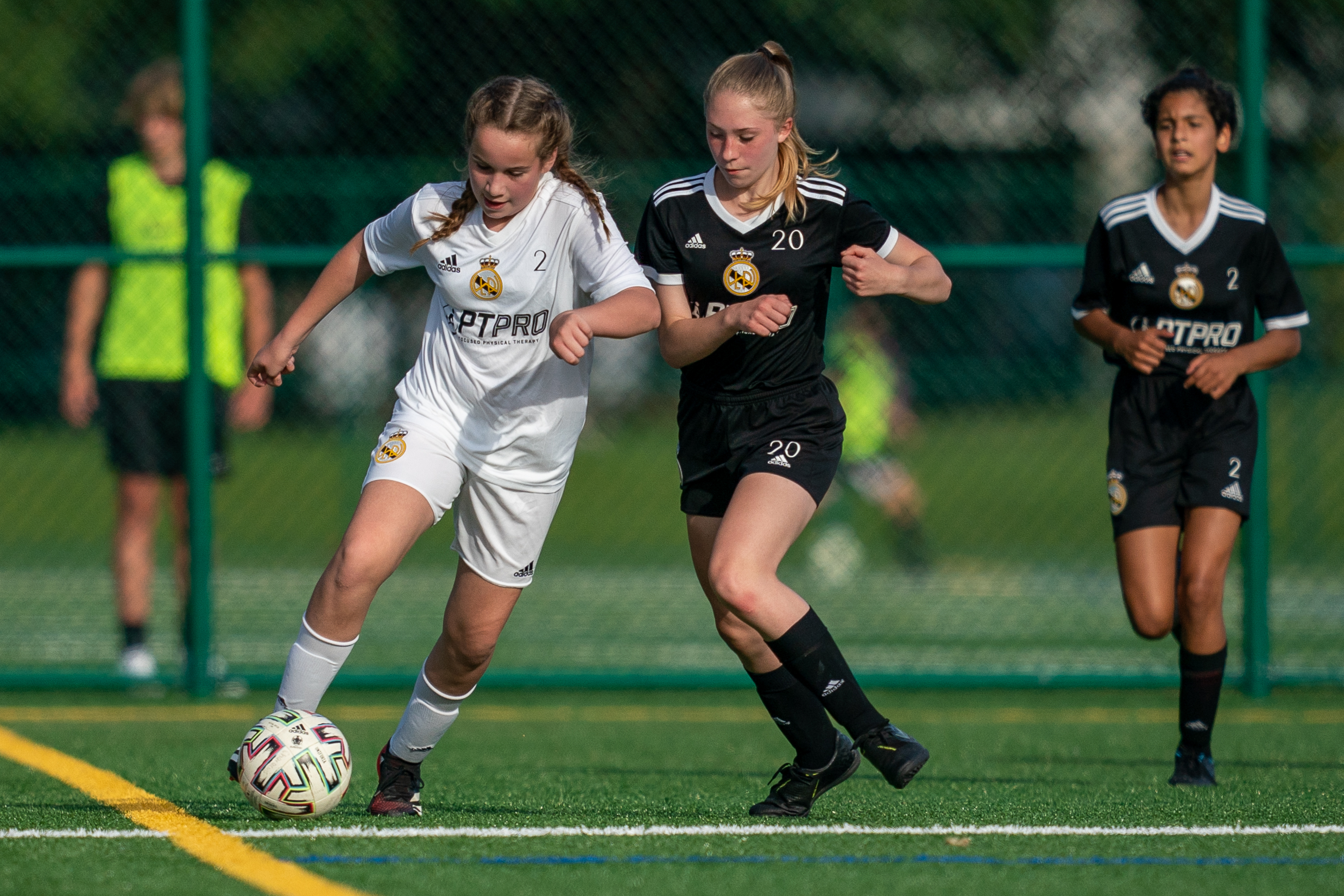 Girls teams playing a small sided game